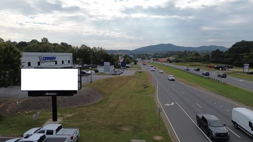 aerial photo of a billboard next to a highway